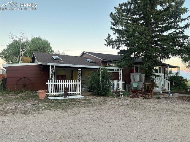 single story home featuring covered porch