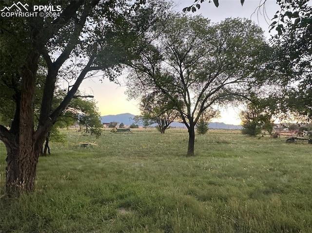 nature at dusk with a mountain view and a rural view