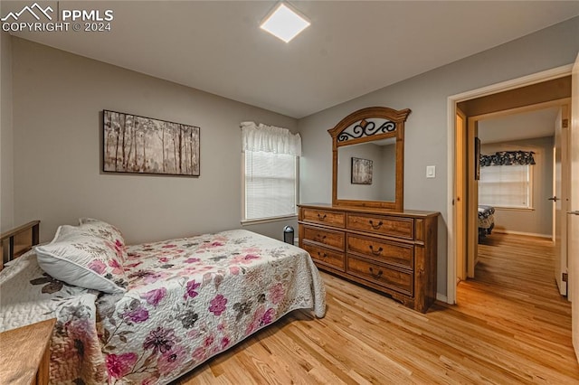 bedroom with light hardwood / wood-style floors