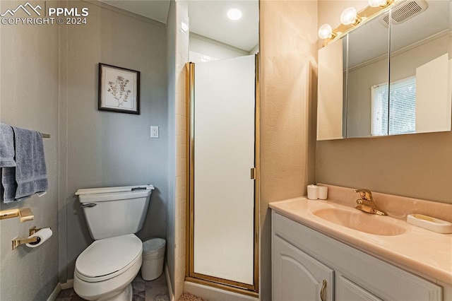 bathroom with tile patterned flooring, a shower with door, toilet, and vanity