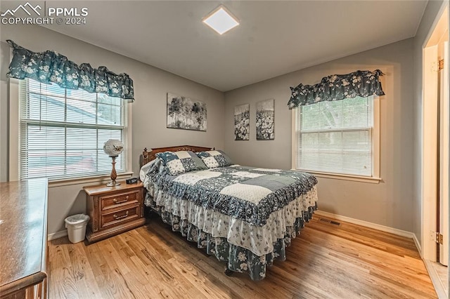 bedroom with light hardwood / wood-style flooring