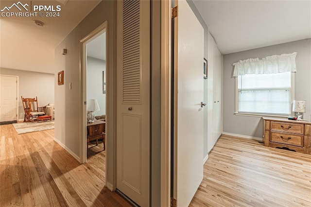 hall with light hardwood / wood-style flooring