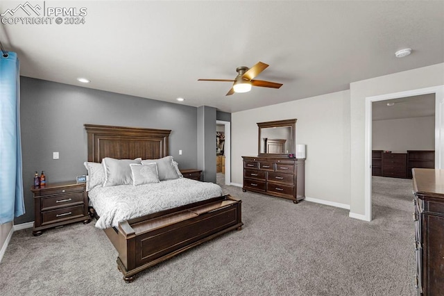 bedroom featuring ceiling fan and light carpet