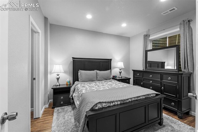 bedroom featuring dark wood-type flooring