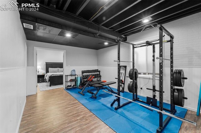 exercise area with hardwood / wood-style flooring