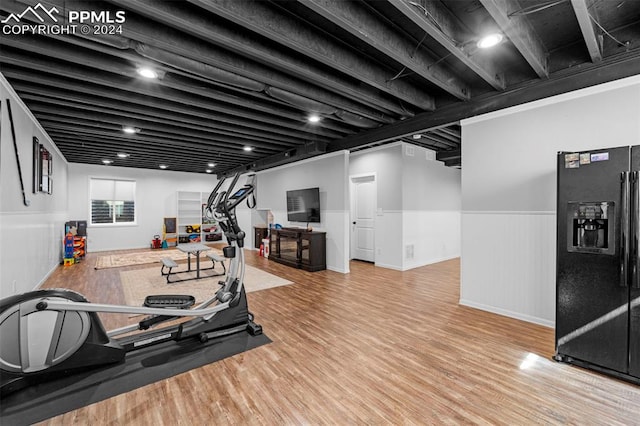 workout room with hardwood / wood-style flooring