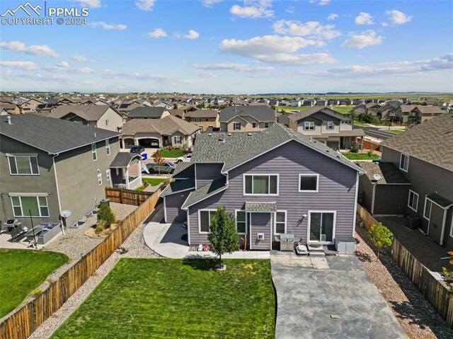 view of front of house featuring a front lawn and a patio