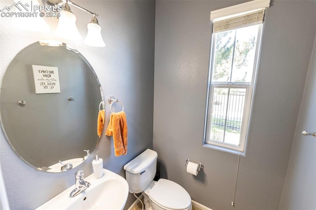 bathroom with sink and toilet