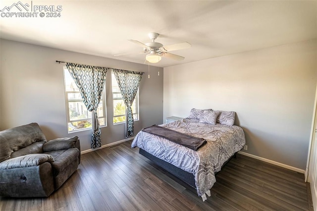 bedroom featuring ceiling fan and dark hardwood / wood-style floors