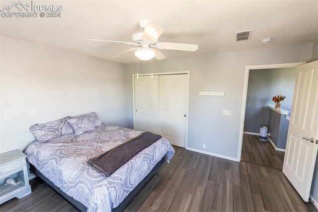 bedroom featuring ceiling fan, a closet, and hardwood / wood-style floors