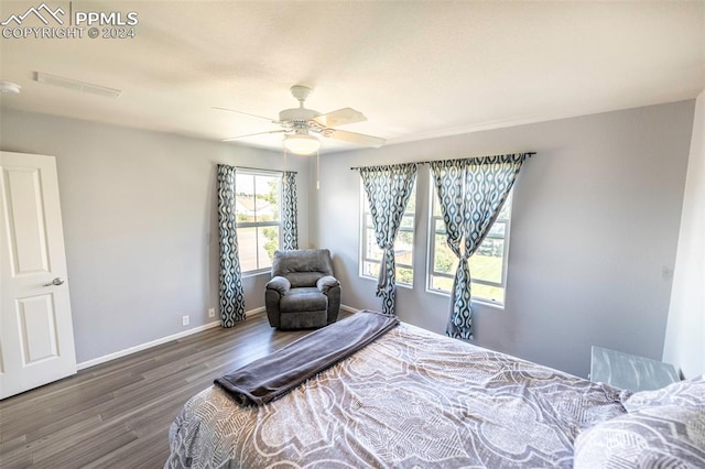 bedroom with ceiling fan and wood-type flooring