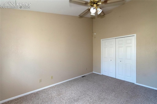 unfurnished bedroom with a closet, carpet flooring, and ceiling fan