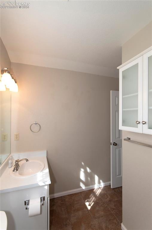 bathroom with vanity and tile patterned flooring