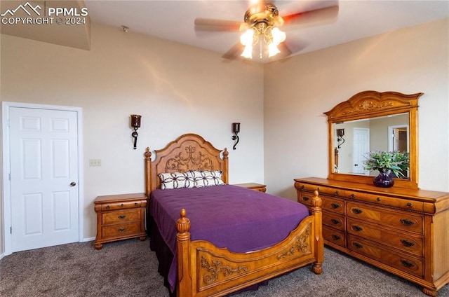 bedroom featuring dark colored carpet and ceiling fan