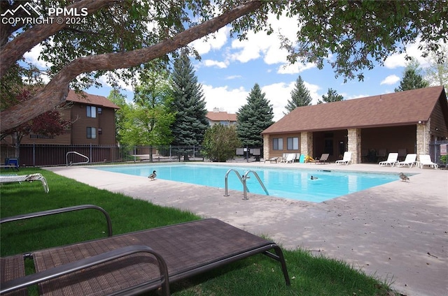 view of swimming pool with a patio