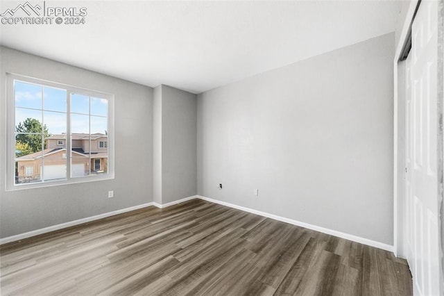 spare room with hardwood / wood-style floors