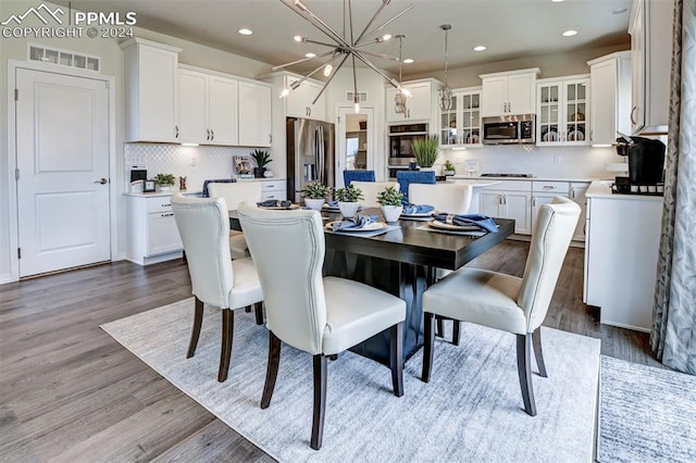 dining room with light hardwood / wood-style floors