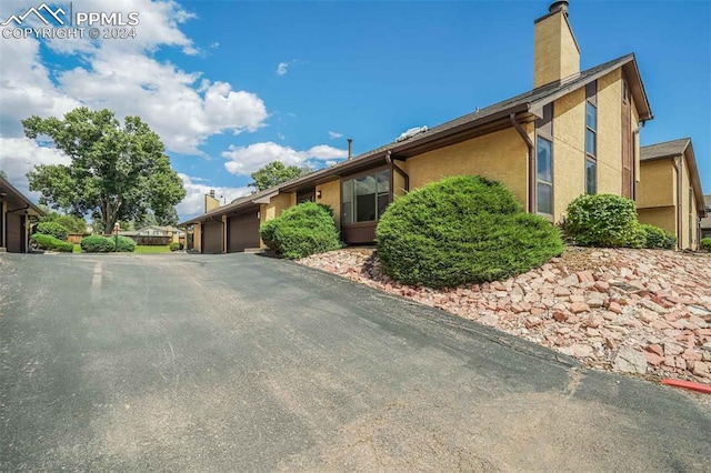 ranch-style home featuring a garage