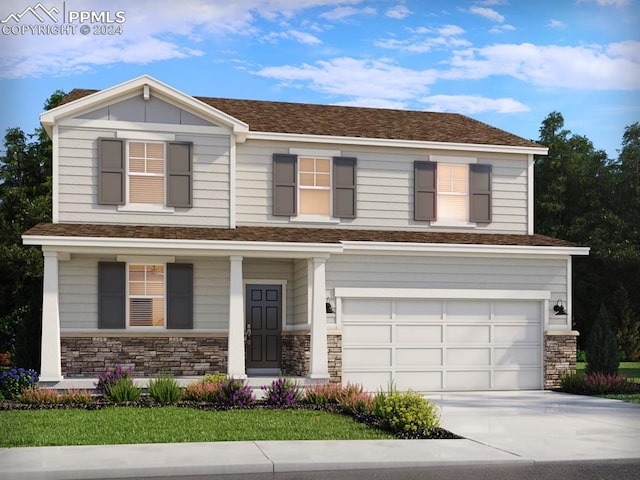 view of front of home with a front yard and a garage