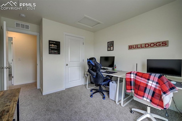 office featuring baseboards, carpet, visible vents, and attic access