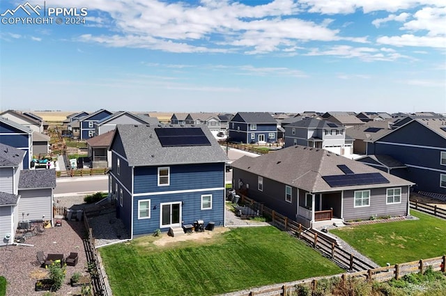 birds eye view of property with a residential view