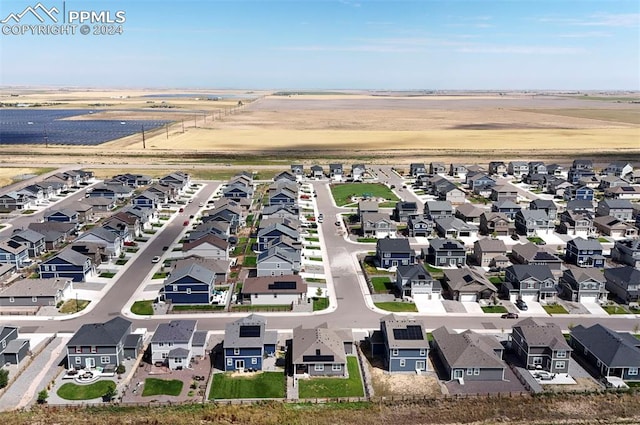 birds eye view of property with a residential view