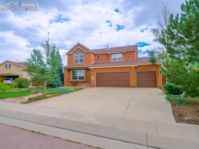 view of front of property with a garage