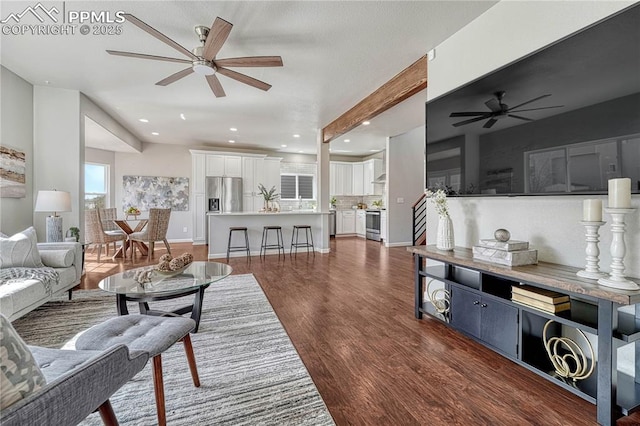 living room featuring dark wood finished floors, recessed lighting, a ceiling fan, and baseboards