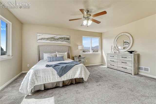 bedroom with carpet flooring, baseboards, and visible vents