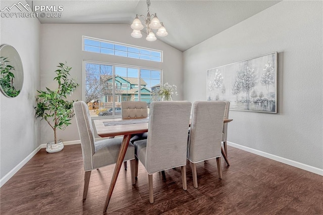 dining room featuring lofted ceiling, wood finished floors, baseboards, and a chandelier