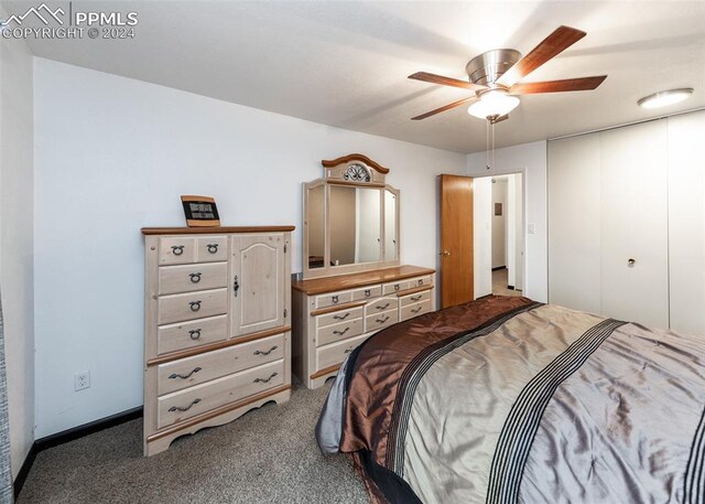 carpeted bedroom with ceiling fan and a closet