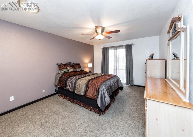 bedroom with ceiling fan and carpet