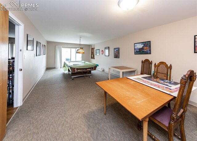 carpeted dining room with pool table