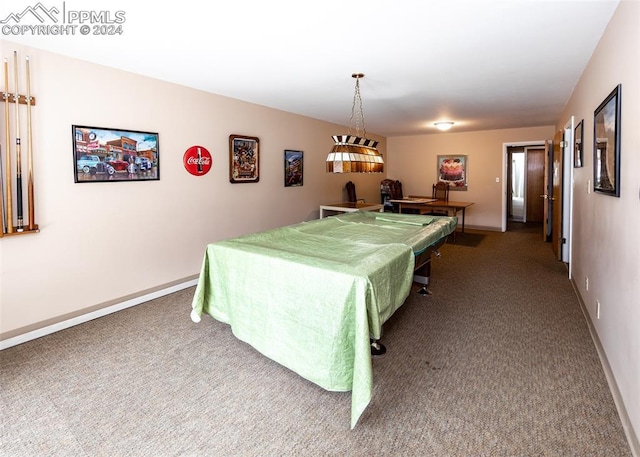 rec room featuring carpet and baseboards