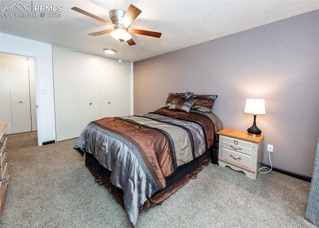 carpeted bedroom with a closet and ceiling fan