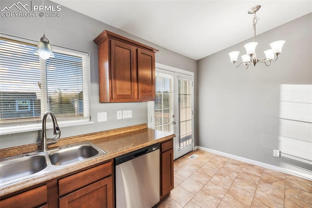 kitchen featuring an inviting chandelier, stainless steel dishwasher, vaulted ceiling, sink, and decorative light fixtures