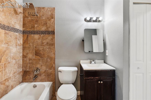 full bathroom featuring vanity, toilet, and tiled shower / bath