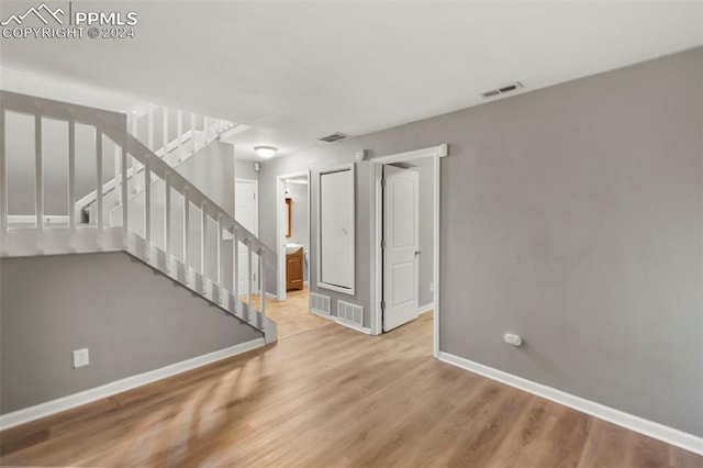 spare room with light wood-type flooring