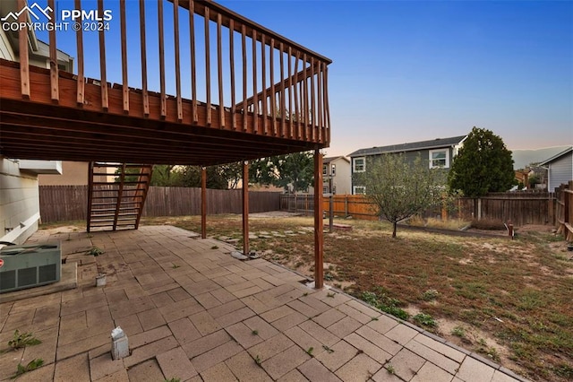 patio terrace at dusk with a deck