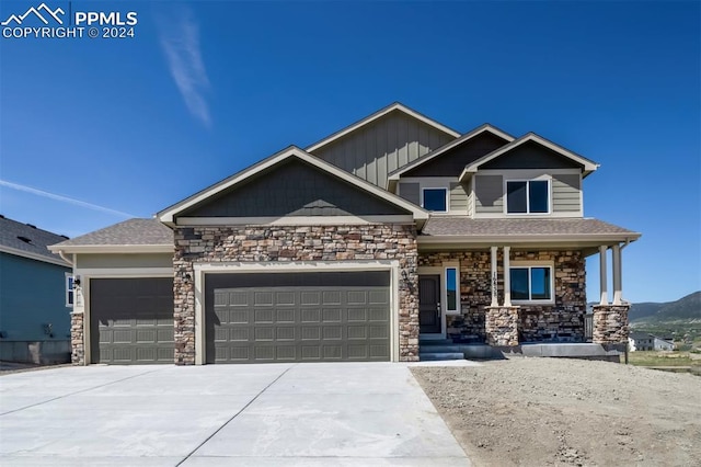 craftsman-style house featuring a garage and a porch