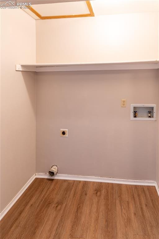 laundry room featuring washer hookup, hardwood / wood-style floors, and electric dryer hookup