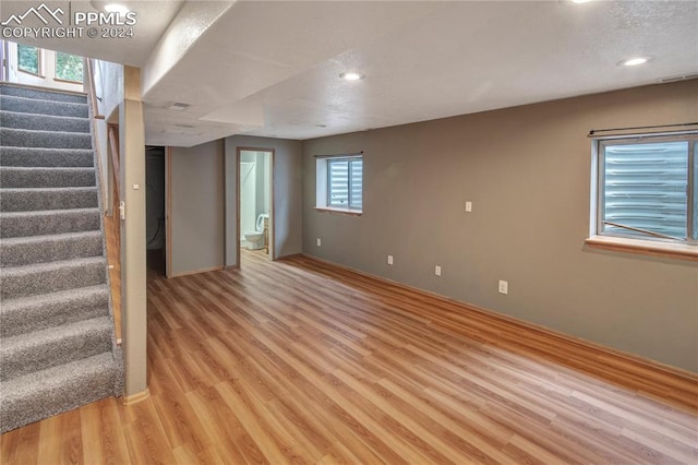 basement featuring light hardwood / wood-style flooring