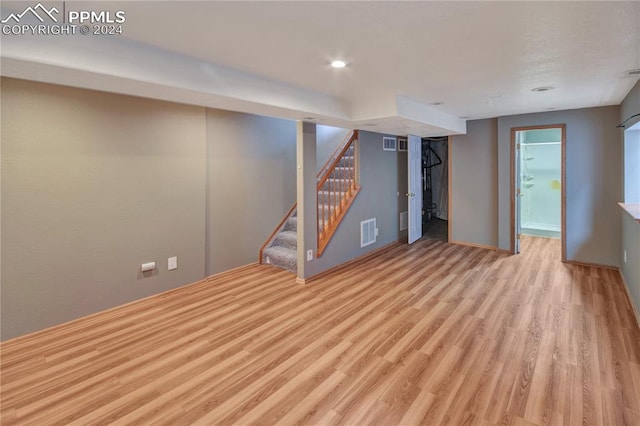 basement featuring light wood-type flooring