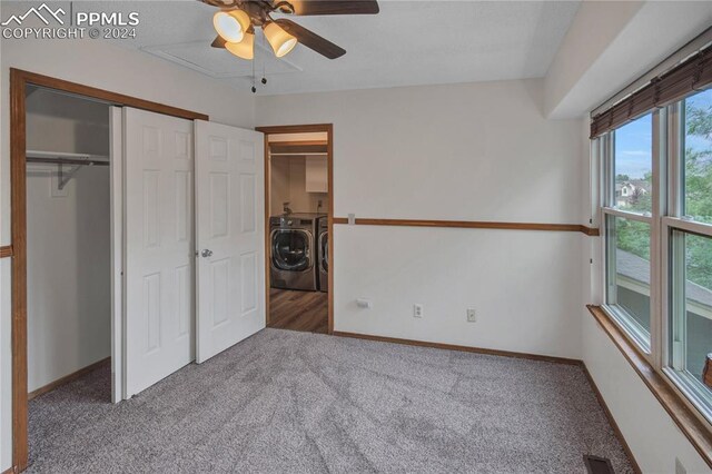 unfurnished bedroom with a closet, washing machine and dryer, ceiling fan, and carpet