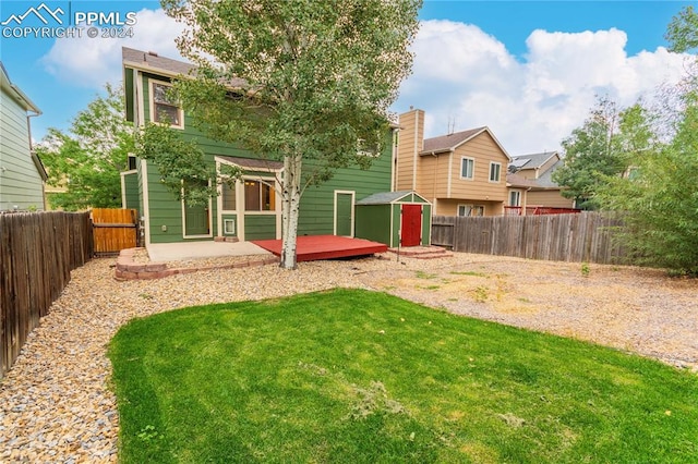 exterior space with a shed and a patio