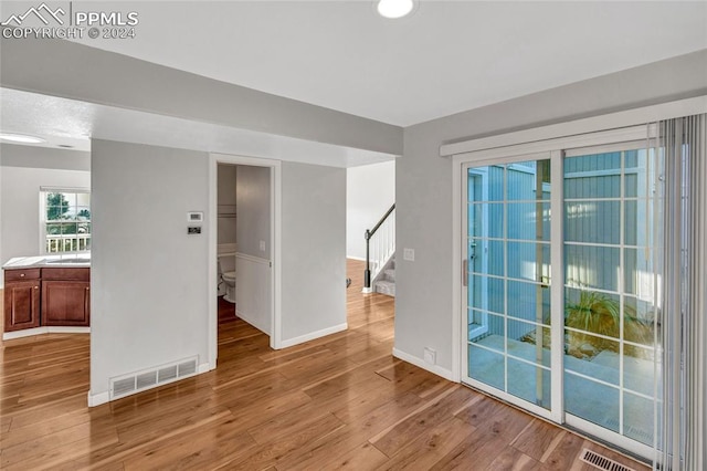 unfurnished room featuring light hardwood / wood-style flooring