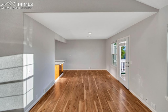 empty room with wood-type flooring