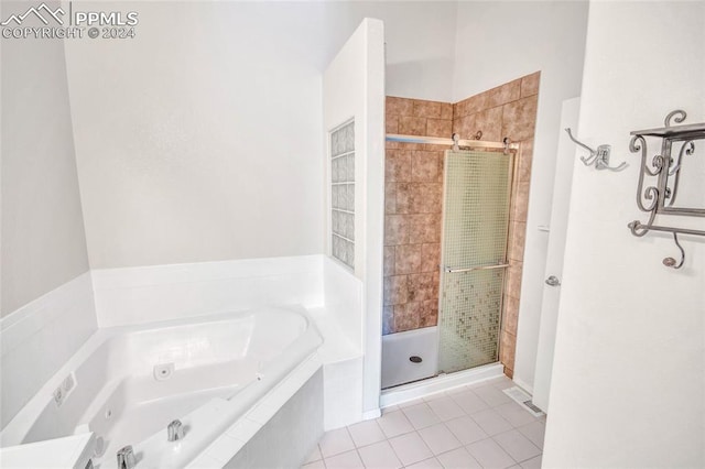 bathroom featuring shower with separate bathtub and tile patterned flooring