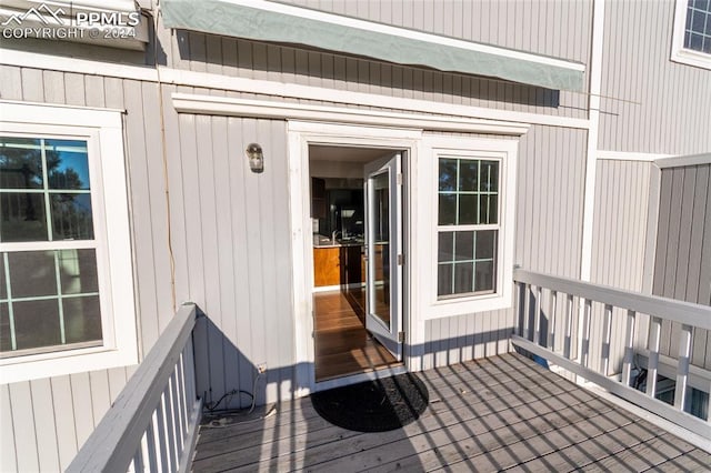 doorway to property with a deck