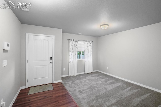 entryway with hardwood / wood-style flooring